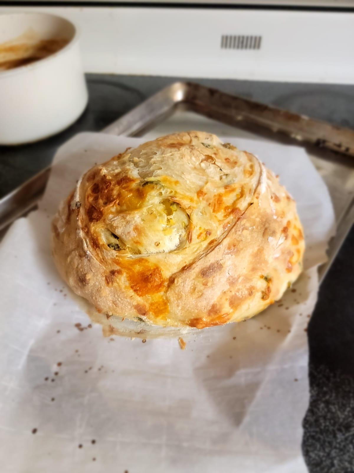 Savory sourdough loaf on parchment